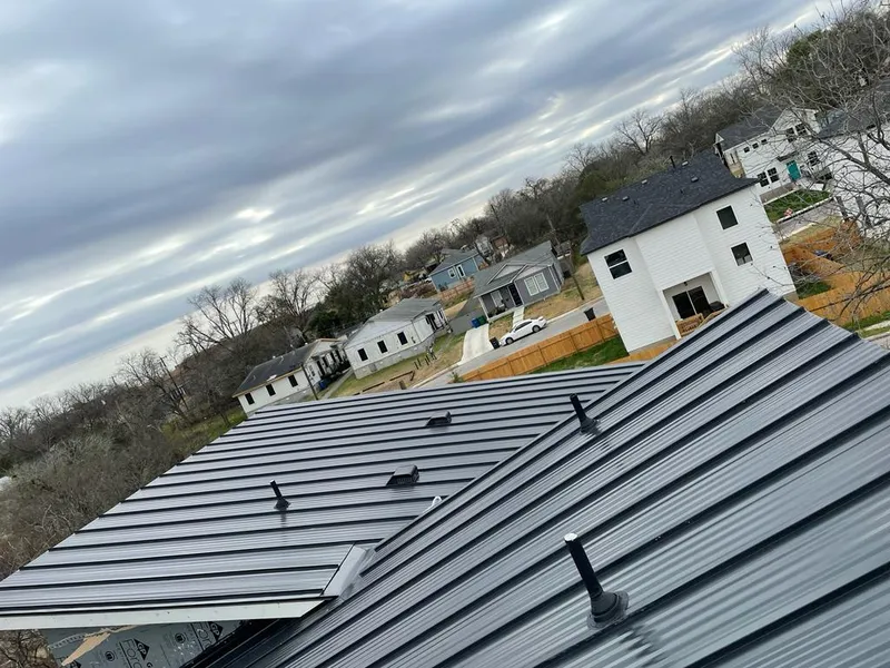 Standing seam metal roof panels with vents for Skylight Repair in Moore